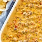 Cheesy hamburger rotel dip in a serving dish.
