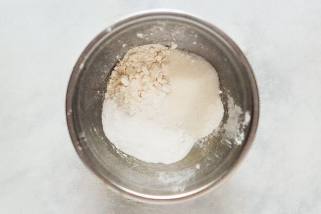 Dry ingredients for pancakes in a mixing bowl.