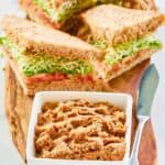Sandwiches made with homemade Loma Linda sandwich spread and a bowl of the spread.