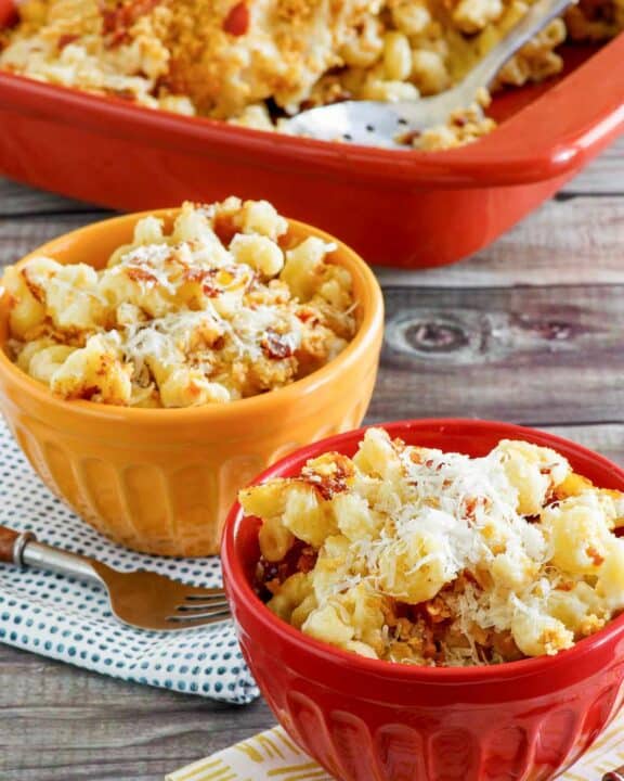 Copycat Longhorn Steakhouse mac and cheese in bowls and baking dish.
