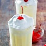 Homemade McDonald's eggnog milkshakes and a bowl of cherries.