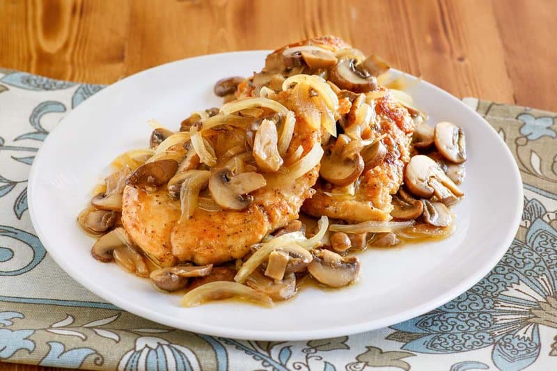 A serving of copycat Olive Garden chicken marsala on a plate.