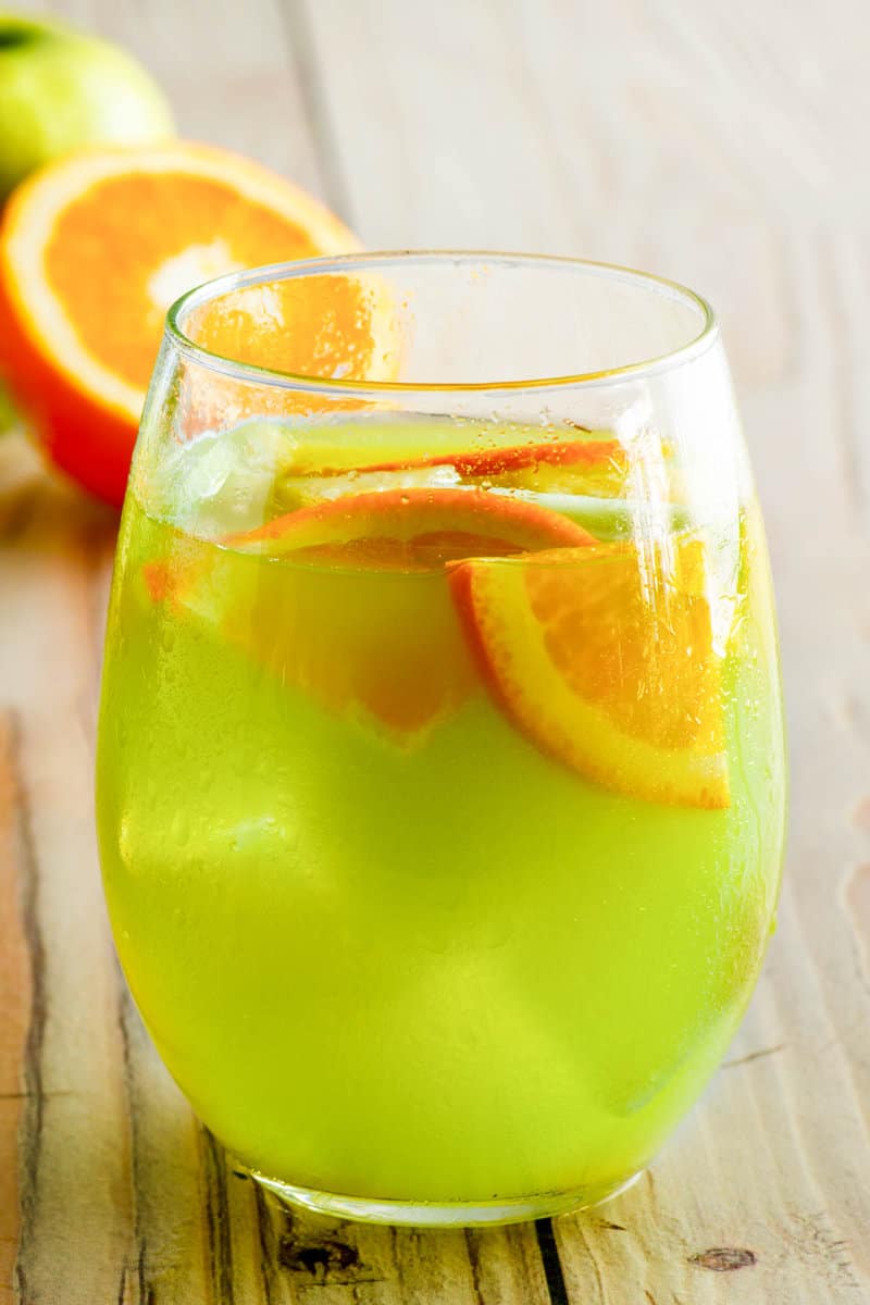 Copycat Olive Garden green apple moscato sangria in a stemless wine glass.