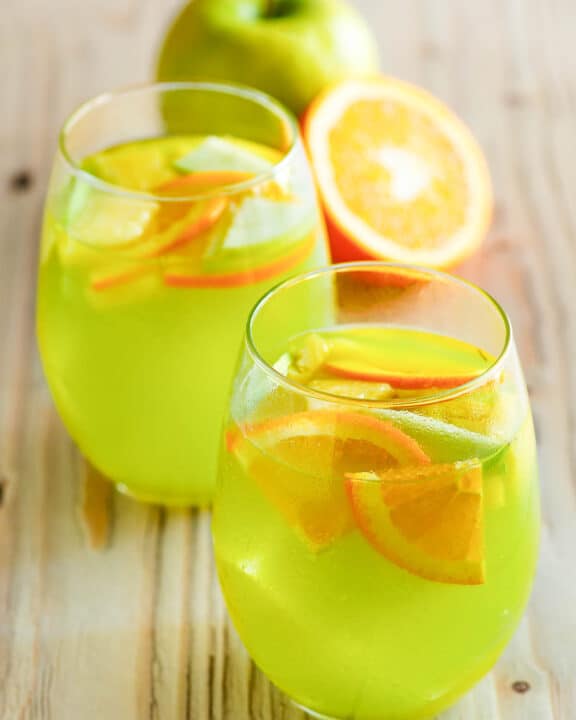 Copycat Olive Garden green apple moscato sangria in two glasses.