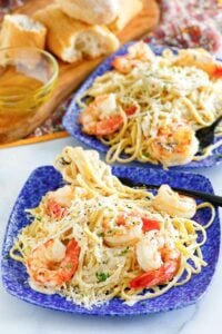 Copycat Olive Garden shrimp alfredo on two plates.