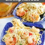 Copycat Olive Garden fettuccine alfredo with shrimp on two plates.