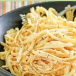 Pasta with garlic, egg, and cheese in a pasta bowl.