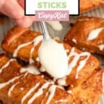 Drizzling cream cheese icing on homemade Pizza Hut cinnamon sticks.
