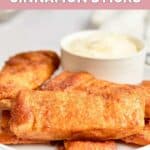 Homemade Pizza Hut cinnamon sticks and dipping sauce on a plate.