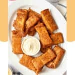 A platter of homemade Pizza Hut cinnamon sticks and dipping sauce.