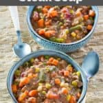 Copycat Plaza III steak soup in two bowls and two spoons.