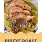 Sliced ribeye roast on a wood cutting board.