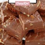 Homemade See's fudge candy pieces on a glass platter.