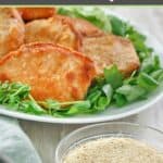 Homemade shake and bake seasoning in a small bowl and a platter of pork chops.