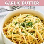 Homemade Spaghetti Warehouse spaghetti with garlic butter and a fork.
