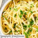 A bowl of homemade Spaghetti Warehouse spaghetti with garlic butter.