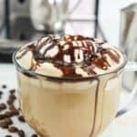 Homemade Starbucks cafe mocha latte in a glass mug.