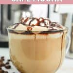 Homemade Starbucks cafe mocha and coffee beans beside it.