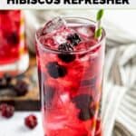 Homemade Starbucks very berry hibiscus refresher drink with a straw.