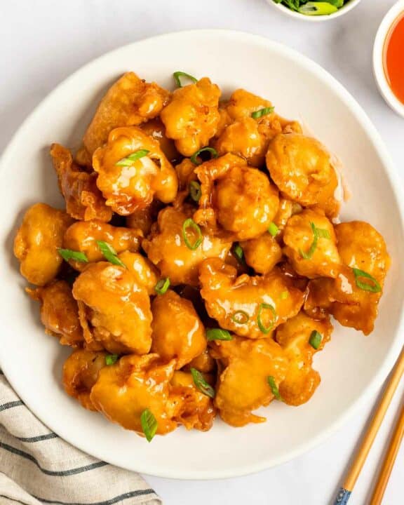 A plate of sweet and sour chicken.