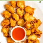 Sweet and sour chicken on a large platter.