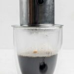 Brewing Vietnamese coffee with a phin filter.