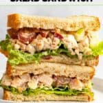 Halves of homemade Arby's pecan chicken salad sandwich stacked on a plate.