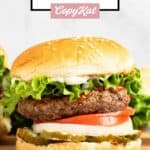 Homemade Burger King Whopper hamburger on a wood board.
