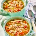 Chicken bisque in two soup crocks.