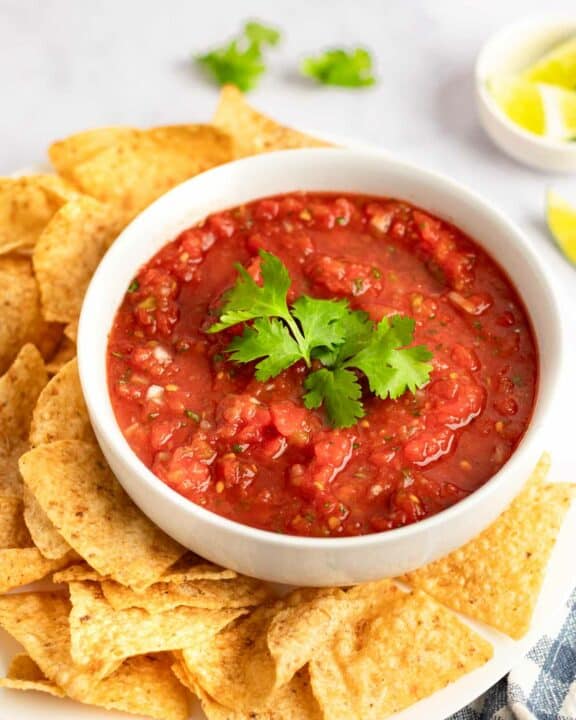 Copycat Chili's salsa and tortilla chips on a platter.