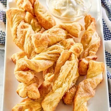 Copycat Cinnabon cinnamon sticks with cream cheese frosting dip.