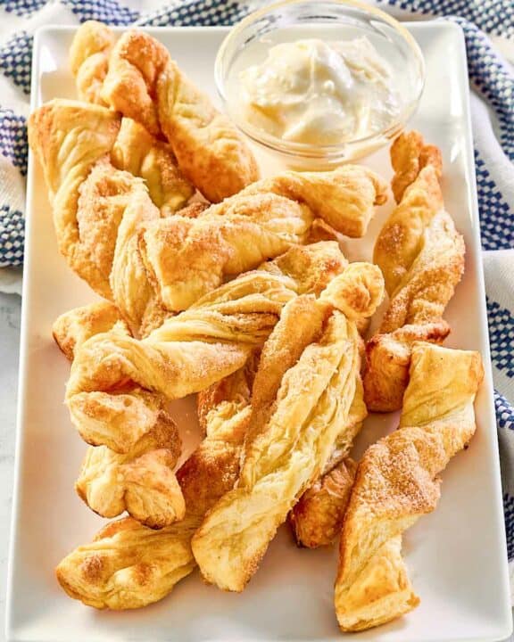 Copycat Cinnabon cinnamon sticks with cream cheese frosting dip.