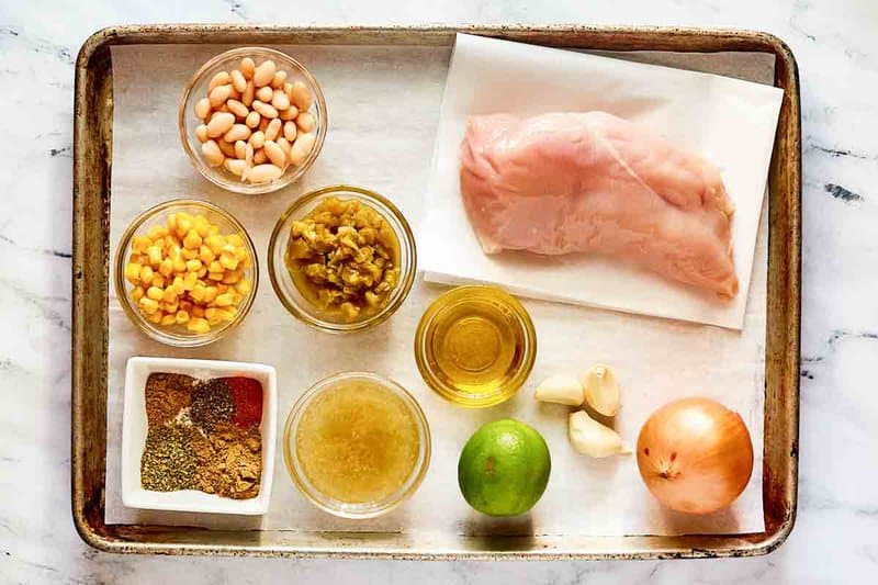 Crockpot white chicken chili ingredients on a tray.