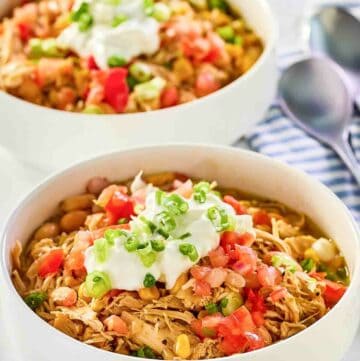 Crockpot white chicken chili in two bowls.