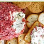 Dried beef cheese ball and different types of crackers.