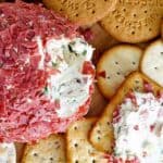 Dried beef cheese ball and some spread on a cracker.