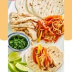Grilled chicken fajitas on a platter.