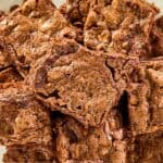 Homemade Hershey's brownies piled on a plate.