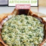 Homemade Houston's spinach and artichoke dip and chips on a platter.