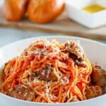 Instant Pot spaghetti and sausage in a pasta bowl.