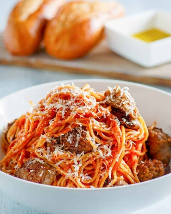 Instant Pot spaghetti and sausage in a pasta bowl.