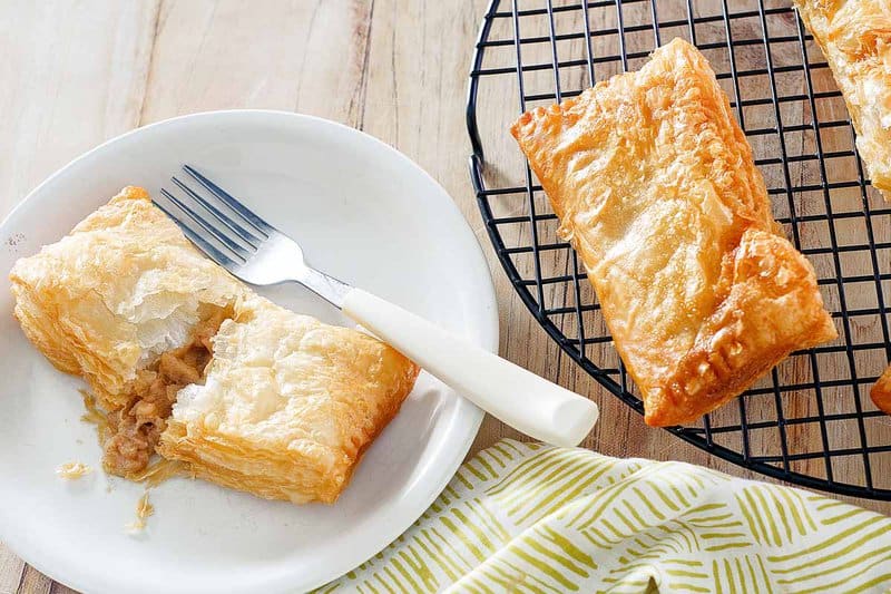 Copycat McDonald's apple pie on a plate and wire rack.