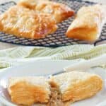 Homemade McDonald's apple pies on a rack and one cut in half on a plate.