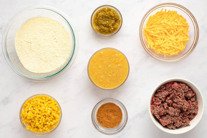 Mexican cornbread casserole ingredients in bowls.