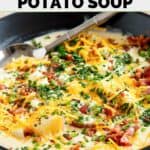 Homemade O'Charley's loaded potato soup garnished with cheese, bacon, and chives.