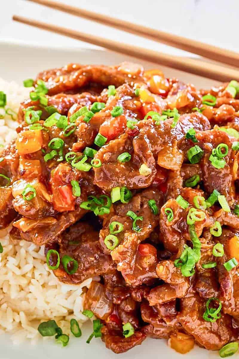 Copycat Panda Express Beijing beef and rice on a plate.