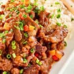 Homemade Panda Express Beijing beef and rice on a plate.