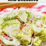 Homemade Pasta house salad with dressing on a plate.