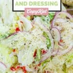 Homemade Pasta House salad with dressing.