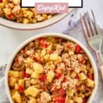 Sausage potato hash in bowls and a fork.